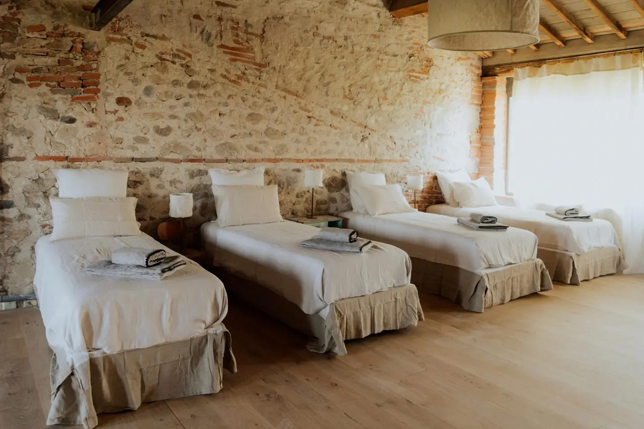 Chambre du gîte à quatre lits simples